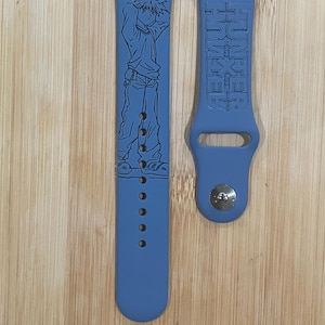 Anime hunter themed engraved design on a silicone watch band compatible with Apple Watch and Galaxy Watch .