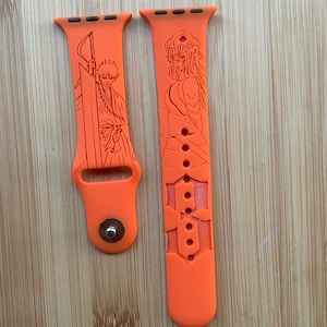 Anime themed samurai character engraved design on a silicone watch band compatible with Apple Watch and Galaxy Watch .