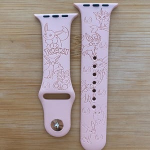 Anime themed cute normal type character engraved design on a silicone watch band compatible with Apple Watch and Galaxy Watch .