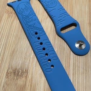 Anime themed, slayer boy character engraved design on a silicone watch band compatible with Apple Watch and Galaxy Watch .