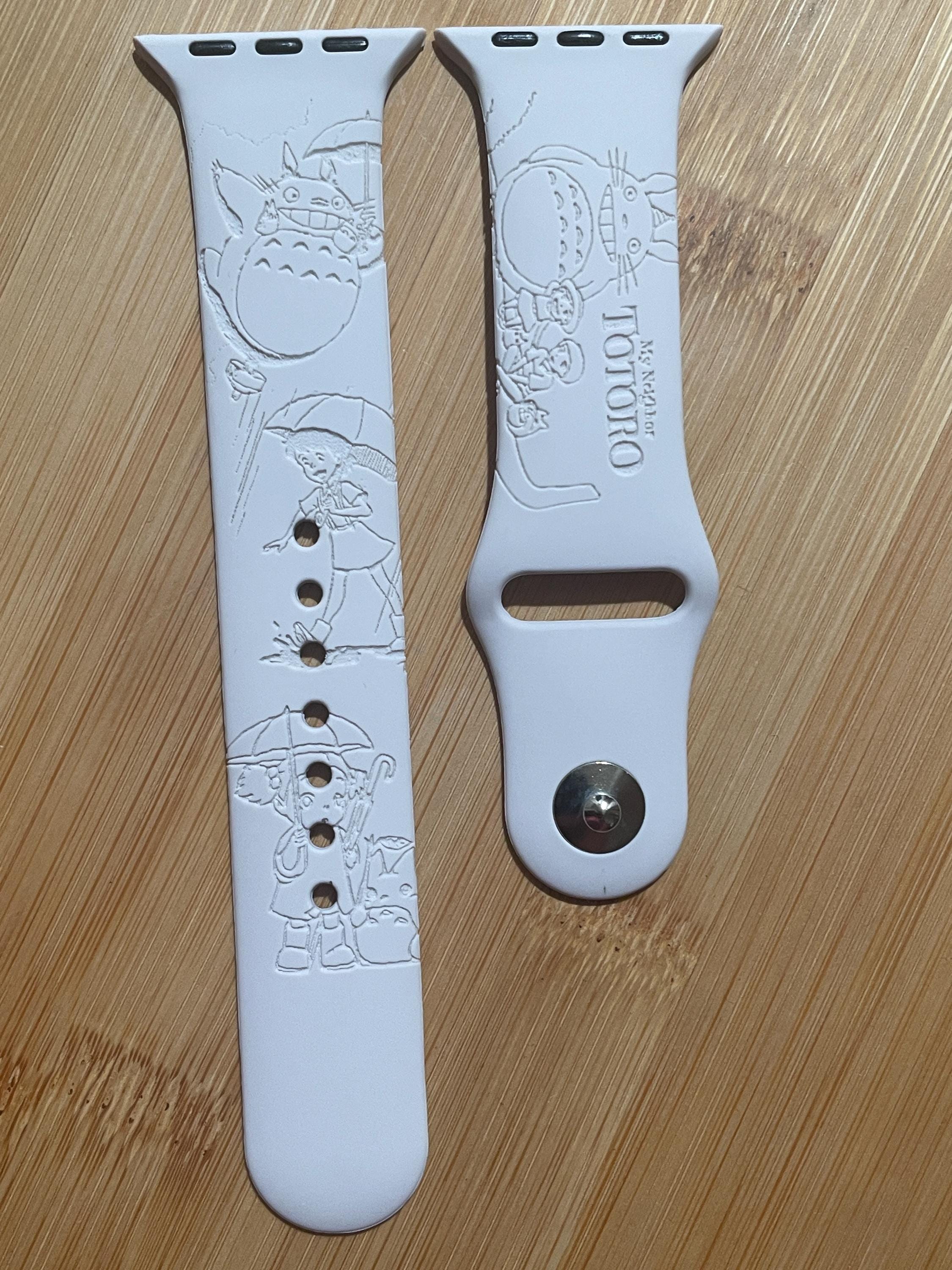 Anime themed, enchanting and magical characters engraved design on a silicone watch band compatible with Apple Watch and Galaxy Watch .
