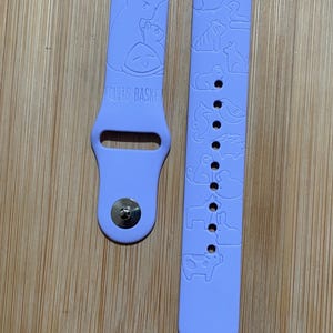 Anime romance themed engraved design on a silicone watch band compatible with Apple Watch and Galaxy Watch .