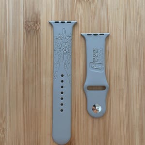 Anime themed engraved design on a silicone watch band compatible with Apple Watch and Galaxy Watch .
