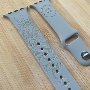 Anime dragon themed engraved design on a silicone watch band compatible with Apple Watch and Galaxy Watch .
