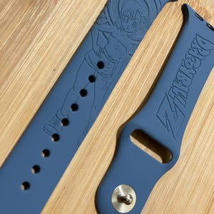 Anime dragon themed engraved design on a silicone watch band compatible with Apple Watch and Galaxy Watch .