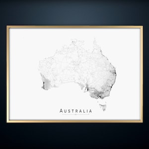 May include: A black and white map of Australia with a white background and a gold frame. The map shows the roads and cities of Australia. The word "AUSTRALIA" is printed in black at the bottom of the map.