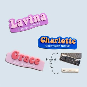 May include: Three colourful name badges with rounded edges. The badges are pink, blue, and light pink. The names on the badges are Lavina Clinical Midwife, Charlotte Registered Nurse, and Grace Registered Nurse. The badges can be attached with a magnet or a pin.