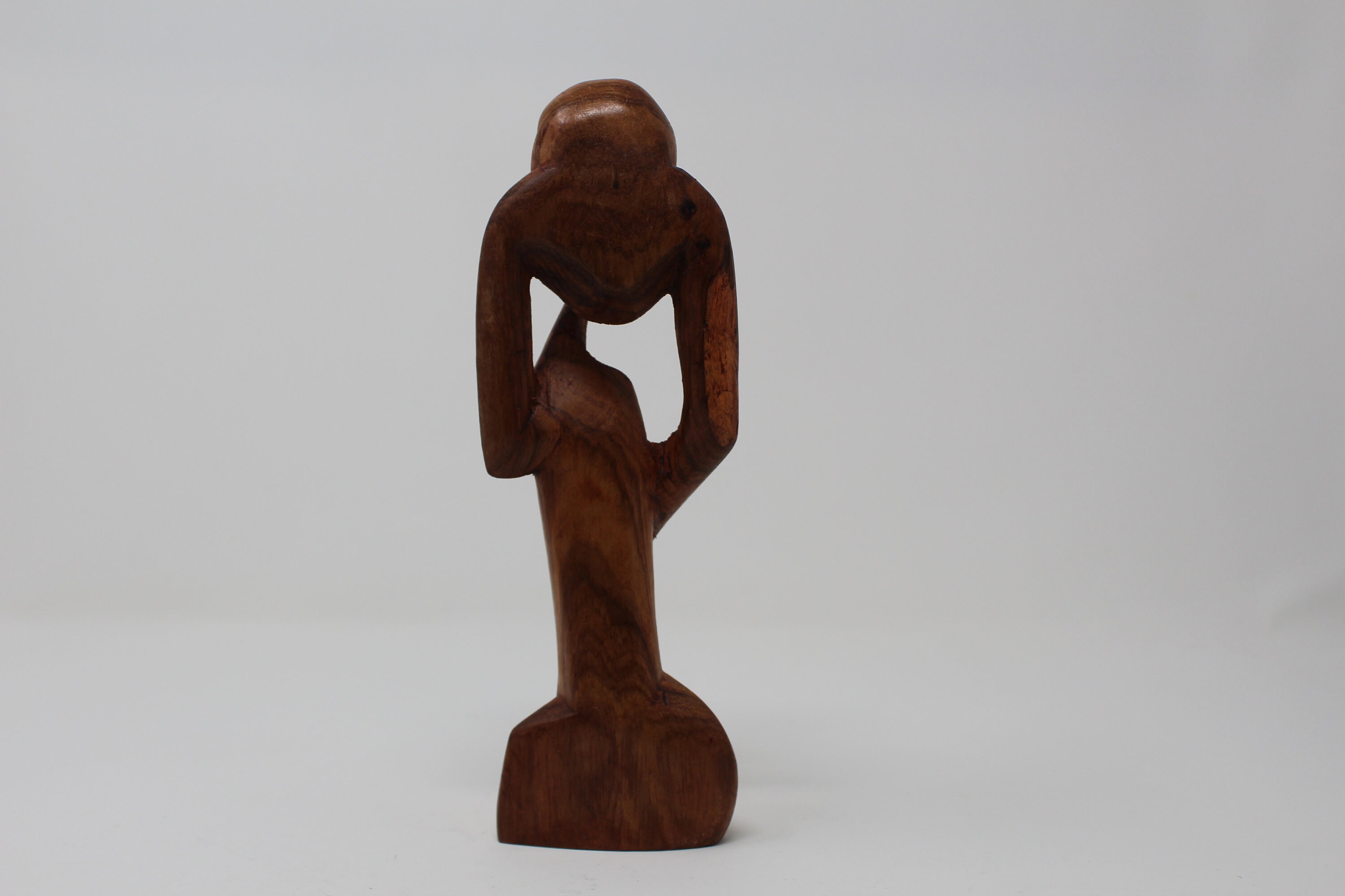 Abstract Wood Sculpture of Man Sitting Down with a Book - Thinker