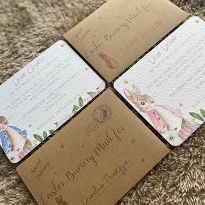 May include: Four brown envelopes with a bunny rabbit illustration and the text "Easter Bunny Mail for" followed by a name. The envelopes are decorated with a floral pattern and a postage stamp.