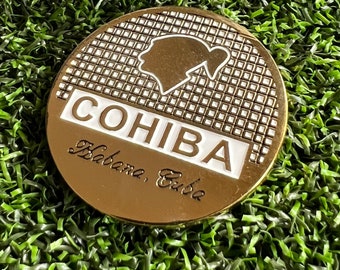 Marcador de pelota de golf con el logotipo del cigarro Cohiba, hecho a mano en metal macizo.