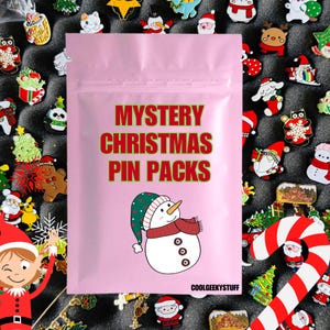 May include: Pink zippered pouch with the text "Mystery Christmas Pin Packs" and a cartoon snowman. The pouch is surrounded by a variety of Christmas-themed enamel pins.