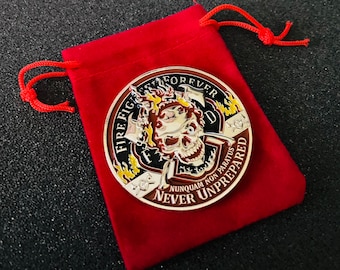 May include: A silver-colored coin with a black and red skull design. The coin has the words "Firefighter Forever" and "Never Unprepared" around the edge. The coin is in a red velvet pouch.