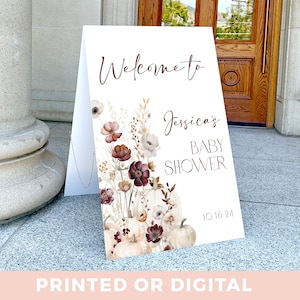 Cartel de bienvenida para baby shower con flores de otoño y calabazas: póster de bienvenida para baby shower con flores burdeos y blancas de otoño.