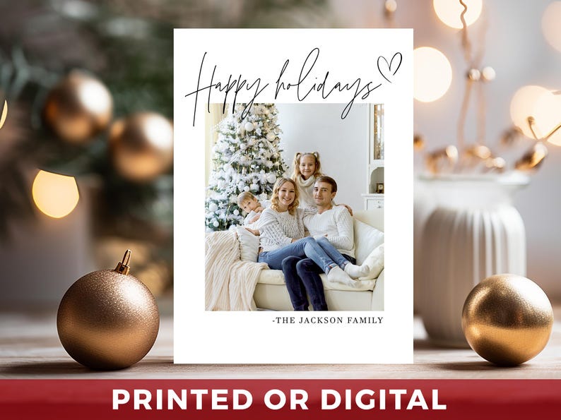 May include: A white holiday card with a family photo, a Christmas tree, and the text "Happy holidays" in cursive. The card also includes the text "-THE JACKSON FAMILY" and the words "PRINTED OR DIGITAL" in a red banner.