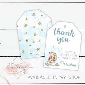 May include: Blue and white thank you tags featuring a Winnie the Pooh illustration and the text "thank you", "a little yummy for your tummy", and "Christine".
