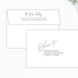 May include: White envelopes with elegant script text. One envelope reads "The Jackson Family" with an address below. Another envelope says "Deliver to" with the "Kepton Family" address. Decorative elements include a gift box and ornaments.