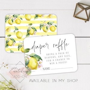 May include: A white card with the text "diaper raffle" in black script font. The text below reads "Bring a pack of diapers. Any size. For a chance to win a prize!" with a blank line for a name. The card has a lemon and leaf pattern border.