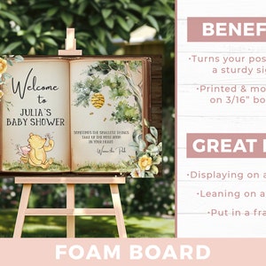 May include: A Winnie the Pooh themed baby shower sign printed on a 3/16 inch foam board. The sign features a watercolour illustration of Winnie the Pooh and Piglet, a beehive, and a quote about the smallest things taking up the most room in your heart. The sign says "Welcome to Julia's Baby Shower".