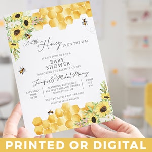 May include: A baby shower invitation with a watercolor design featuring sunflowers, bees, and a honeycomb pattern. The text reads "A Little Honey Is On The Way" and includes details about the shower, including the date, time, location, and RSVP information.
