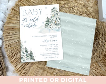 May include: A baby shower invitation with a winter theme. The invitation features a watercolor illustration of a snowy forest with pine trees and the text "Baby it's cold outside". The invitation is for Abigail Lewis and includes the date, time, and location of the shower.