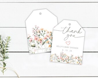 May include: Two white gift tags with a floral design. The tag on the left has a watercolor floral design with pink and yellow flowers. The tag on the right has the text "Thank you" in cursive with a pink heart and the text "Kelly's Baby Shower 6.15.24".
