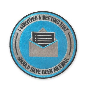 May include: A blue and silver embroidered patch with the text "I survived a meeting that should have been an email". The patch features a stylized image of an envelope with a piece of paper inside.