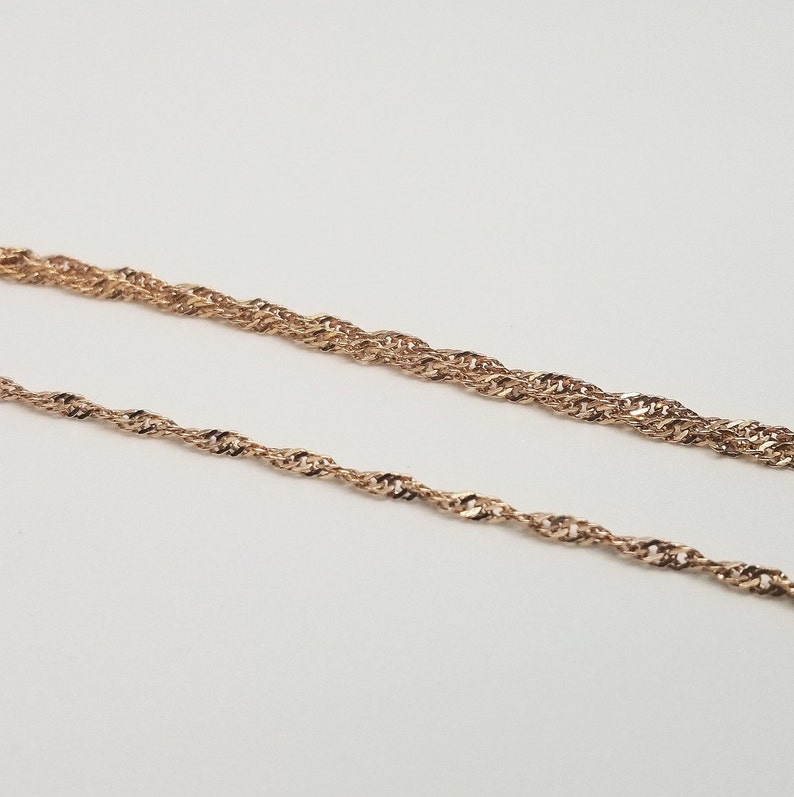 side by side of single chain bracelet and double chain bracelet.