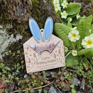 May include: A wooden Easter bunny envelope with blue ears, a small amount of cash inside, and the text "Sophia Happy Easter Treat yourself this Easter Love Auntie Lydia".