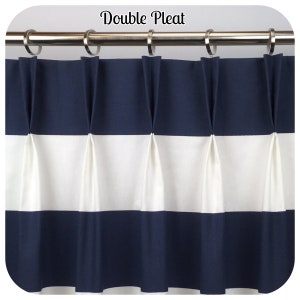 May include: Double pleated navy blue and white striped curtain panel. The curtain is hung on a silver rod with silver rings. The text "Double Pleat" is at the top of the image.