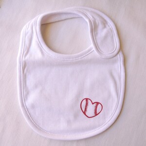 Baby bib with pink baseball heart graphic, bib, velcro release, suits age 0-6 months