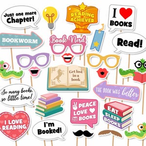 May include: A collection of book-themed photo booth props on sticks, including speech bubbles with text like Just one more Chapter, I love BOOKS, and Read, plus illustrations of glasses, books, worms, a trophy, and a mustache on wooden dowels.