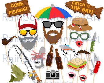 May include: A collection of fishing-themed photo booth props on sticks, including signs reading GONE FISHING! and CATCH OF THE DAY!, a colorful umbrella, hats, sunglasses, beards, a pipe, a fishing rod with a fish, bait, bottles, a camera, and knives.
