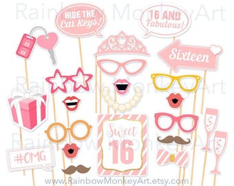 May include: A collection of pink and white party photo booth props on wooden sticks, including a tiara, glasses, lips, mustaches, a gift box, champagne flutes, and signs with text like HIDE THE CAR KEYS, 16 AND FABULOUS, Sixteen, Sweet 16, and #OMG.