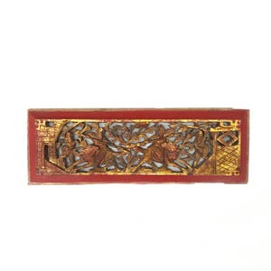 May include: A rectangular wooden panel with intricate carvings of figures and foliage. The panel is painted red with gold accents.