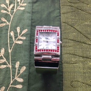 Quartz Watch with Red Bling!  Keeps great time, battery just replaced.