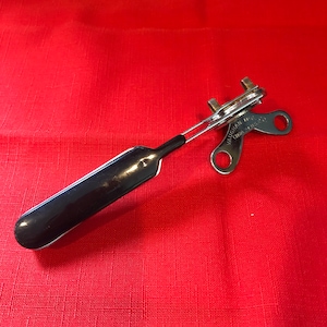 Vaughan Mfg Co. Can opener/bottle opener, Black Bakelite Handle, USA