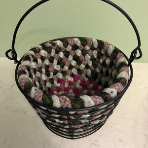 Metal Basket with Hand-braided Insert, pink/olive/light blue, 8” across, 6” tall, 9” tall with handle up.