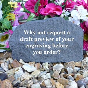 May include: A gray stone with the text "Why not request a draft preview of your engraving before you order?" on it. The stone is surrounded by small, gray, brown, and white rocks.
