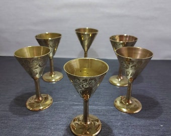 A set of six Indian brass goblets.