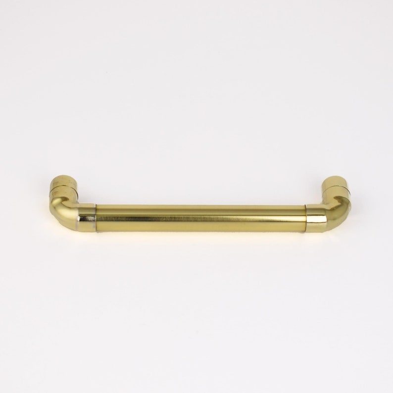 polished natural brass pull handles for modern kitchen designs