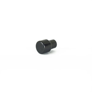 May include: A black plastic knob with a cylindrical shape.
