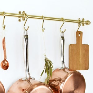 Kitchen Rail Storage with Copper Pot and Pans