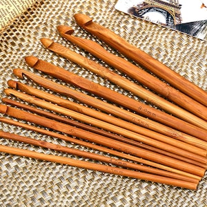 May include: A set of ten bamboo crochet hooks in various sizes, ranging from 3.5 mm to 8.0 mm. The hooks are made of natural bamboo and have a smooth, polished finish.