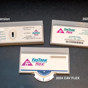 May include: Three Fastrak Flex transponders are displayed against a dark background. The top transponder is labeled "Old FLEX Version." The other two are labeled "2020 CAV FLEX" and "2024 CAV FLEX." Each has the Fastrak logo and text.