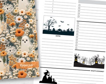 May include: A floral-patterned notebook with ghost illustrations and the name "Rebecca" on a label. Next to it is a planner page with a Halloween theme, including silhouettes of a graveyard, bats, and a witch.