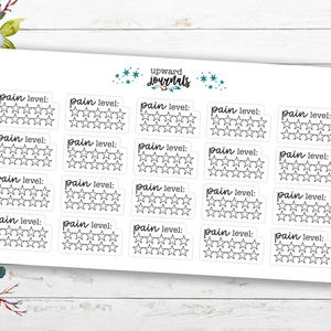 May include: A sheet of stickers with the text "pain level:" above a series of five stars. The stickers are arranged in rows and columns. The text "upward journals" is at the top of the sheet.