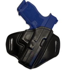 May include: A black leather holster for a handgun. The holster has a belt loop and a snap closure. The gun is not included.