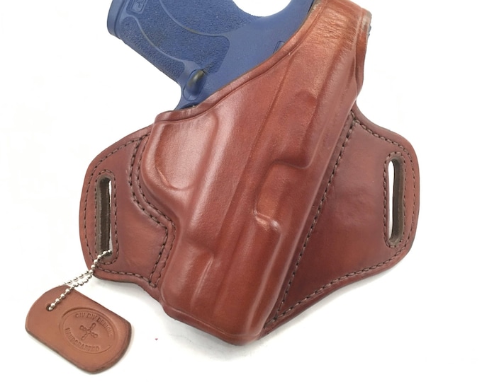 S & W MP Shield 45 with retention strap - Handcrafted Leather Pistol Holster