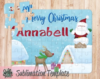 May include: A blue and white Christmas jigsaw puzzle featuring Santa Claus climbing down a chimney, a reindeer with a green scarf, and a house with lights. The puzzle is personalised with the name "Annabell" and the text "Merry Christmas".