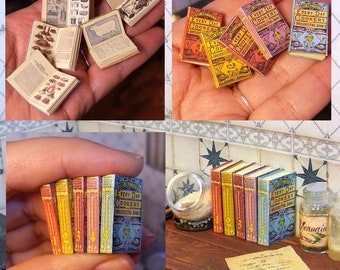May include: A set of miniature vintage cookbooks with the title "Every Day Cookery Housekeeping Book" on the cover. The books are arranged in a stack and on a shelf. The books are yellow, orange, red, blue, and green.
